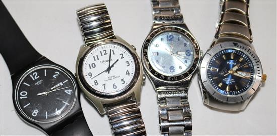 Two Swatch watches, an atomic talking watch and a Pulsar kinetic watch.